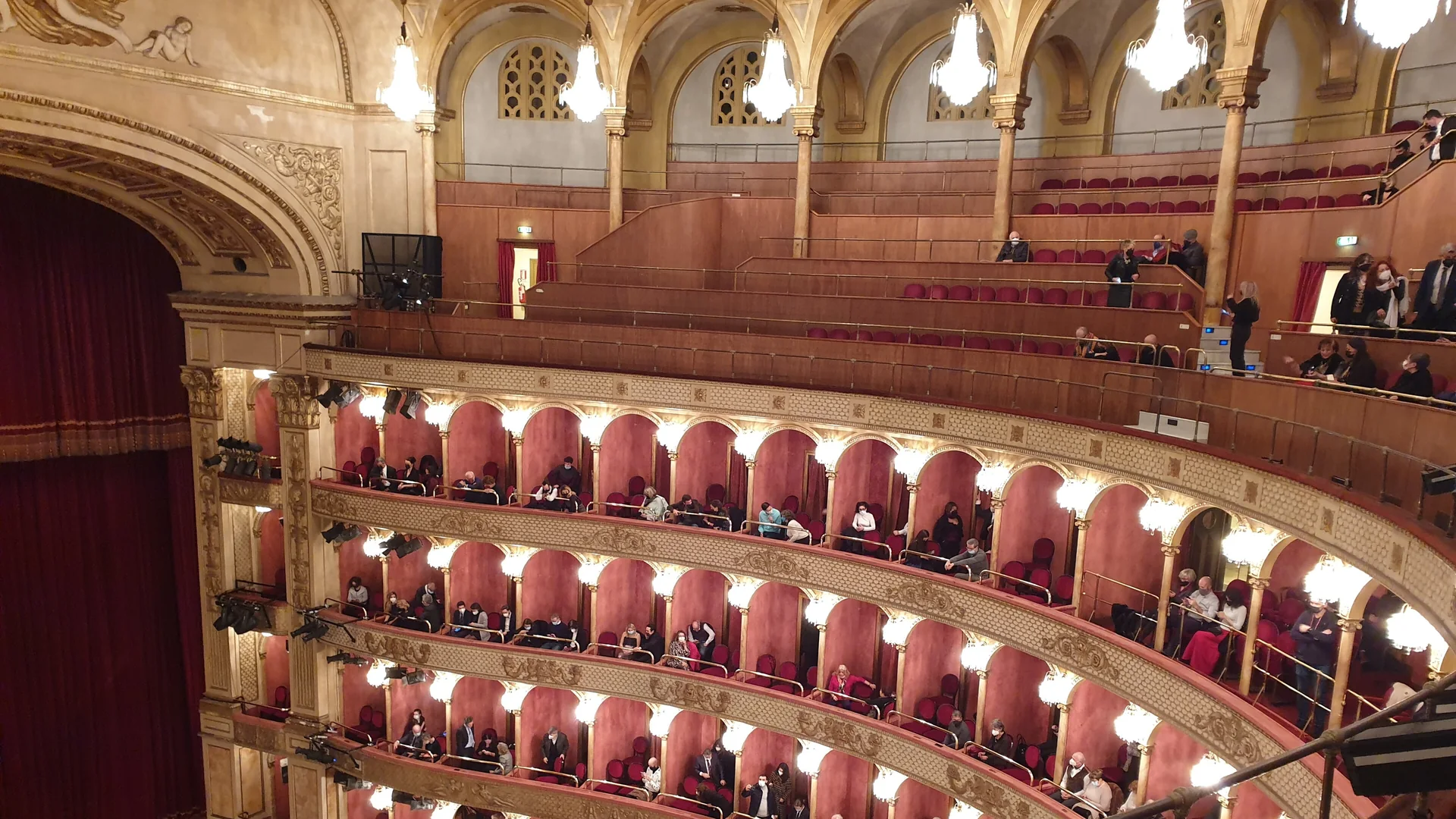 The red-and-gold tiers of boxes in the Teatro Costanzi, the auditorium of Rome's opera house, where Puccini's Tosca had its first performance in 1900.